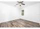 Bright bedroom with wood-look floors and a ceiling fan at 6010 Anise Dr, Sarasota, FL 34238