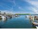 Community boat dock with several boats at 605 Sutton Pl # 205, Longboat Key, FL 34228