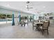 Bright community room with tables and chairs at 605 Sutton Pl # 205, Longboat Key, FL 34228