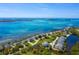 Aerial view of waterfront community with lush landscaping and private docks at 61 Tidy Island Blvd, Bradenton, FL 34210