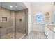 Bathroom with a glass shower and water view at 61 Tidy Island Blvd, Bradenton, FL 34210