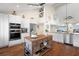Gourmet kitchen boasts double ovens, ample counter space, and island at 61 Tidy Island Blvd, Bradenton, FL 34210