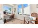 Home office with built-in desk, water views, and comfortable seating at 61 Tidy Island Blvd, Bradenton, FL 34210
