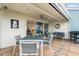 Relaxing patio with seating area, dining table, and grill at 61 Tidy Island Blvd, Bradenton, FL 34210