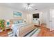 Bright bedroom with wood floors and ceiling fan at 6514 Bowdoin Pl, Bradenton, FL 34207