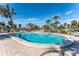 Relaxing kidney-shaped pool with lounge chairs at 6514 Bowdoin Pl, Bradenton, FL 34207