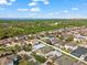 Aerial view of a house and neighborhood, showcasing the surrounding area and landscape at 7308 Tangle Bend Dr, Gibsonton, FL 33534