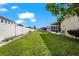 Expansive backyard, grassy lawn and fence at 7308 Tangle Bend Dr, Gibsonton, FL 33534