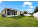 Large backyard with grassy area and fence at 7308 Tangle Bend Dr, Gibsonton, FL 33534