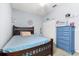 Cozy bedroom with a double bed and dresser at 7308 Tangle Bend Dr, Gibsonton, FL 33534
