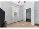 Bedroom with ceiling fan, walk-in closet, and neutral decor at 7308 Tangle Bend Dr, Gibsonton, FL 33534