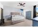 Spacious bedroom with ceiling fan and large bed at 7308 Tangle Bend Dr, Gibsonton, FL 33534