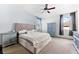 Main bedroom with ceiling fan and large bed at 7308 Tangle Bend Dr, Gibsonton, FL 33534