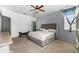 Main bedroom with ceiling fan and large bed at 7308 Tangle Bend Dr, Gibsonton, FL 33534