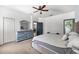 Spacious bedroom with large bed and ceiling fan at 7308 Tangle Bend Dr, Gibsonton, FL 33534
