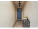 Inviting entryway with gray door and tile flooring at 7308 Tangle Bend Dr, Gibsonton, FL 33534