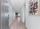 Bright hallway with wood-look floors at 7308 Tangle Bend Dr, Gibsonton, FL 33534