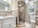 Updated bathroom with a walk-in shower and tiled floors at 7331 Westmoreland Dr, Sarasota, FL 34243