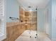 Spacious bathroom with walk-in shower, grab bars, and modern tile at 7331 Westmoreland Dr, Sarasota, FL 34243