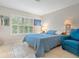 Serene bedroom with window seat and a comfy armchair at 7331 Westmoreland Dr, Sarasota, FL 34243