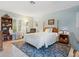 Bright bedroom featuring a comfortable bed and ample closet space at 7331 Westmoreland Dr, Sarasota, FL 34243