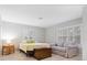 Charming bedroom with a cozy sitting area and natural light at 7331 Westmoreland Dr, Sarasota, FL 34243