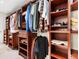 Large walk-in closet with custom built-ins and ample storage at 7331 Westmoreland Dr, Sarasota, FL 34243