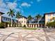 Attractive courtyard with palm trees and a geometric brick design at 7331 Westmoreland Dr, Sarasota, FL 34243