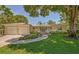 Ranch style home with attached two-car garage, mature landscaping, and a spacious front yard at 7331 Westmoreland Dr, Sarasota, FL 34243