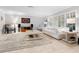 Light-filled living room with a neutral color palette and ample seating at 7331 Westmoreland Dr, Sarasota, FL 34243