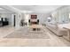 Bright living room features tile floors, comfy seating, and large windows at 7331 Westmoreland Dr, Sarasota, FL 34243