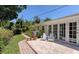 Charming patio with seating area, adjacent to the house at 7331 Westmoreland Dr, Sarasota, FL 34243