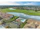 Aerial view of community pool, golf course, and residential buildings at 8105 Grand Estuary Trl # 307, Bradenton, FL 34212