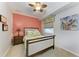 Bright bedroom with wood bed frame and tropical decor at 8105 Grand Estuary Trl # 307, Bradenton, FL 34212