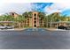 Condo building with parking and lush landscaping at 8105 Grand Estuary Trl # 307, Bradenton, FL 34212