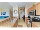 Kitchen with granite countertops, stainless steel appliances, and a view into the living area at 8105 Grand Estuary Trl # 307, Bradenton, FL 34212