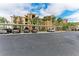 Condo building with covered parking and landscaping at 8105 Grand Estuary Trl # 307, Bradenton, FL 34212