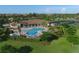 Community pool with lounge chairs and spa at 8105 Grand Estuary Trl # 307, Bradenton, FL 34212