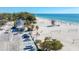 Aerial view of beach, lifeguard stand, and volleyball courts at 1125 Edgewater Cir # 13 Sec 1, Bradenton, FL 34209