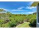 Tranquil backyard view overlooking lush greenery and canal at 1125 Edgewater Cir # 13 Sec 1, Bradenton, FL 34209