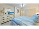 Bright bedroom with a comfortable bed and dresser at 1125 Edgewater Cir # 13 Sec 1, Bradenton, FL 34209