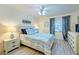 Bedroom with queen-size bed and access to balcony at 1125 Edgewater Cir # 13 Sec 1, Bradenton, FL 34209