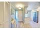 Bright and airy entryway with built-in bench, and adjacent kitchen at 1125 Edgewater Cir # 13 Sec 1, Bradenton, FL 34209