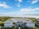 Front view of condo building showcasing waterfront location and architectural details at 1125 Edgewater Cir # 13 Sec 1, Bradenton, FL 34209