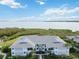 Exterior view of condo building with waterfront view at 1125 Edgewater Cir # 13 Sec 1, Bradenton, FL 34209