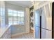 Bright laundry room features stacked washer and dryer, granite countertops, and ample cabinetry at 1125 Edgewater Cir # 13 Sec 1, Bradenton, FL 34209
