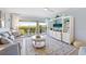 Living room with water views, light blue walls, and white built-ins at 1125 Edgewater Cir # 13 Sec 1, Bradenton, FL 34209