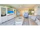 Spacious living area with gray sofa and white built-ins at 1125 Edgewater Cir # 13 Sec 1, Bradenton, FL 34209
