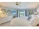 Main bedroom with king-size bed, water views, and white dresser at 1125 Edgewater Cir # 13 Sec 1, Bradenton, FL 34209