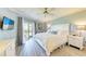 Main bedroom with king-size bed and water views at 1125 Edgewater Cir # 13 Sec 1, Bradenton, FL 34209